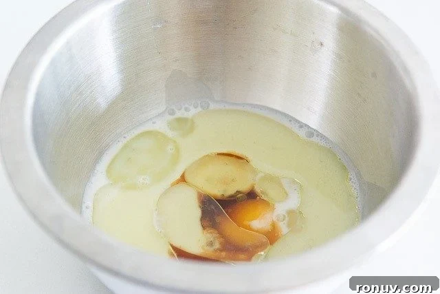 Chocolate Peanut Butter Cupcakes Recipe 6 Buttermilk, Eggs, Oil, and Vanilla in Bowl