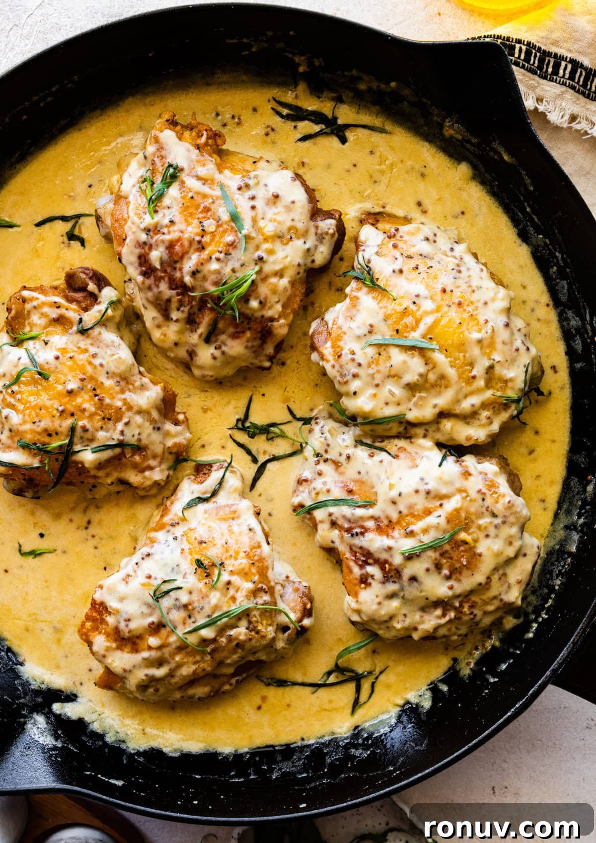 Pan-Seared Chicken Thighs in Creamy Mustard Sauce 2 How to make chicken thighs with creamy mustard sauce recipe- add the tarragon to the creamy chicken skillet.