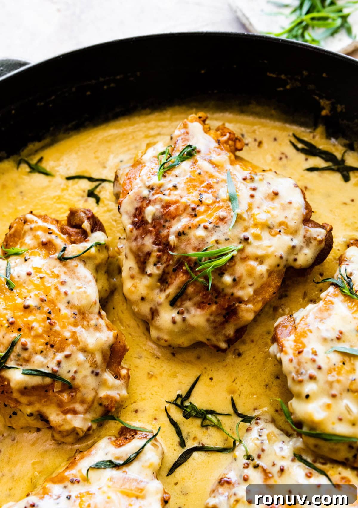 Pan-Seared Chicken Thighs in Creamy Mustard Sauce 13 How to make chicken thighs with creamy mustard sauce recipe- add the tarragon to the creamy chicken skillet.
