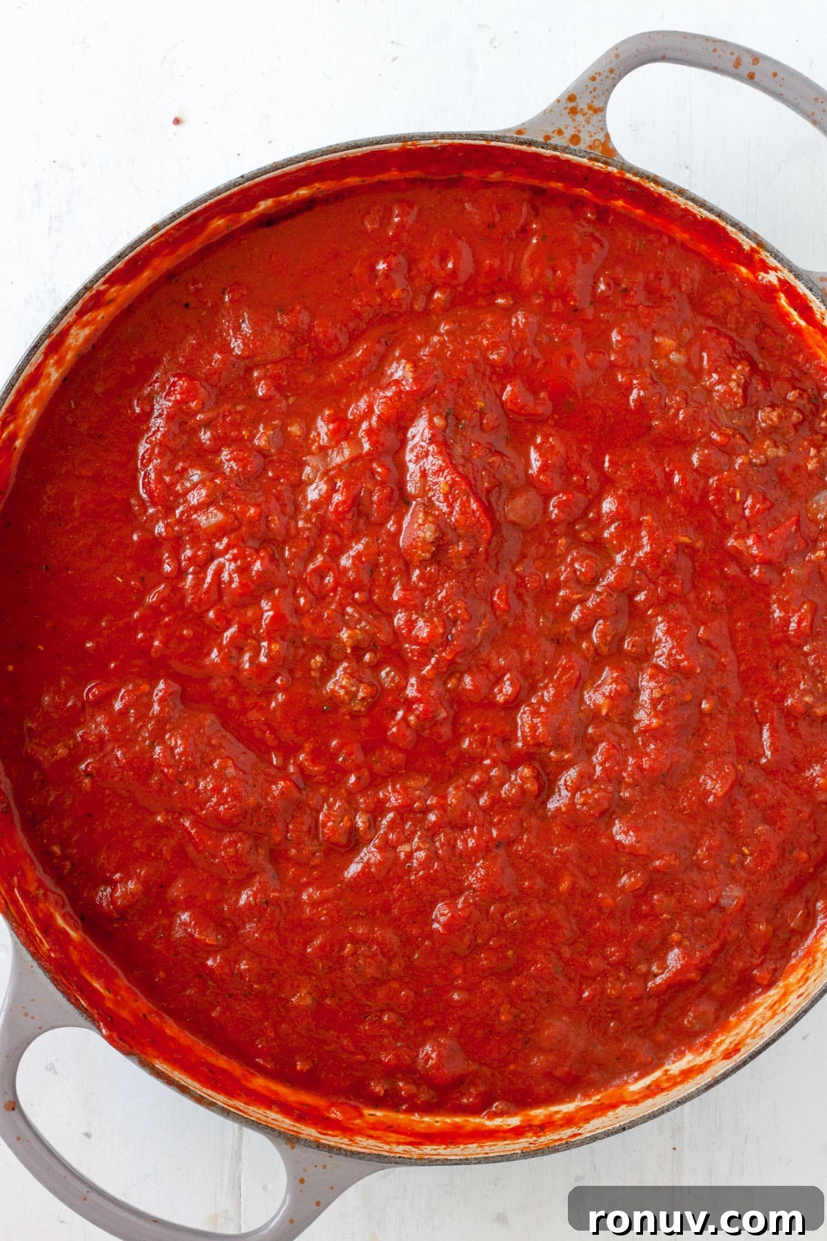 Baked Rigatoni with Cheese and Tomato Sauce 6 Tomato sauce cooking in a large skillet.