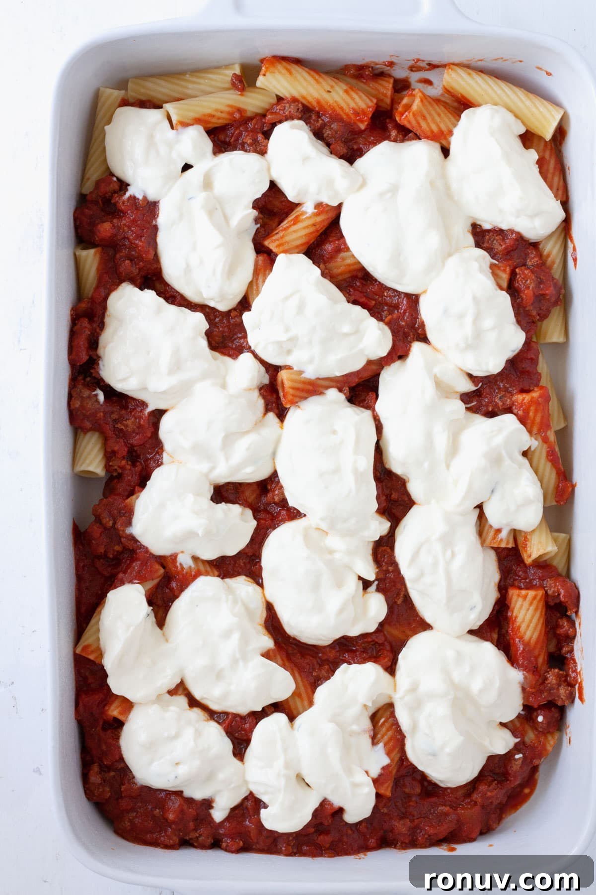 Baked Rigatoni with Cheese and Tomato Sauce 8 Ricotta dolloped on a partially assembled rigatoni al forno.