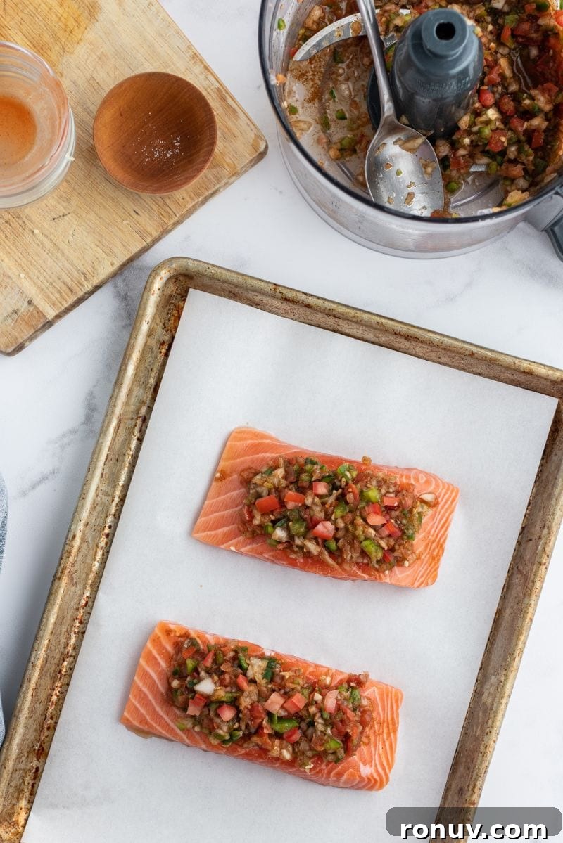 Salsa topped salmon ready for oven salsa topped salmon on baking sheet ready for oven
