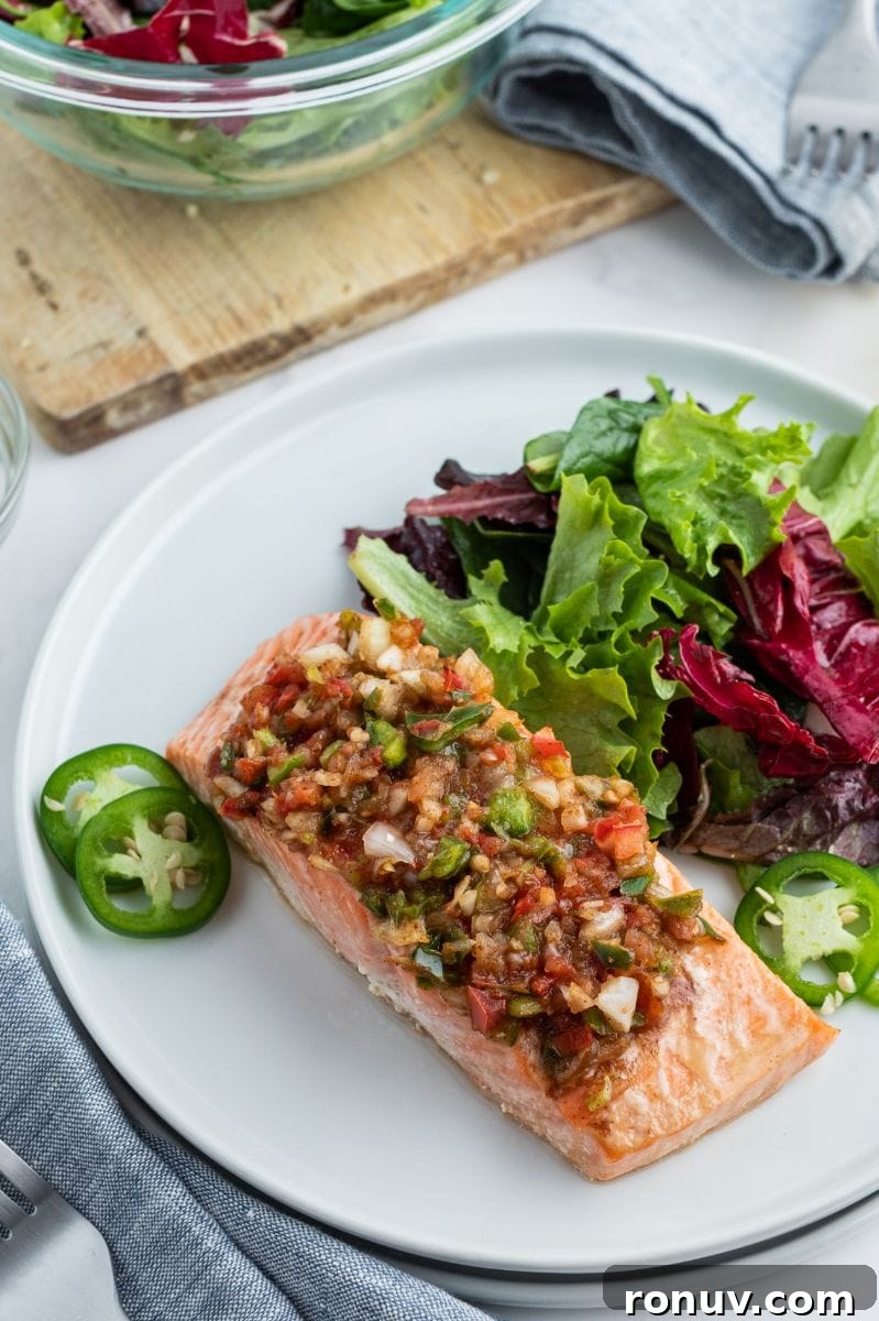 Salsa Roasted Salmon plated salsa roasted salmon on white plate with salad