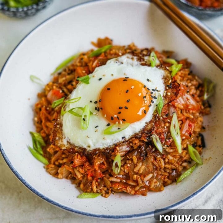 Flaky Bacon, Cheddar and Chive Breakfast Biscuits Recipe 9 Easy kimchi fried rice in a bowl with a fried egg, sesame seeds, and scallions on top with chopsticks.