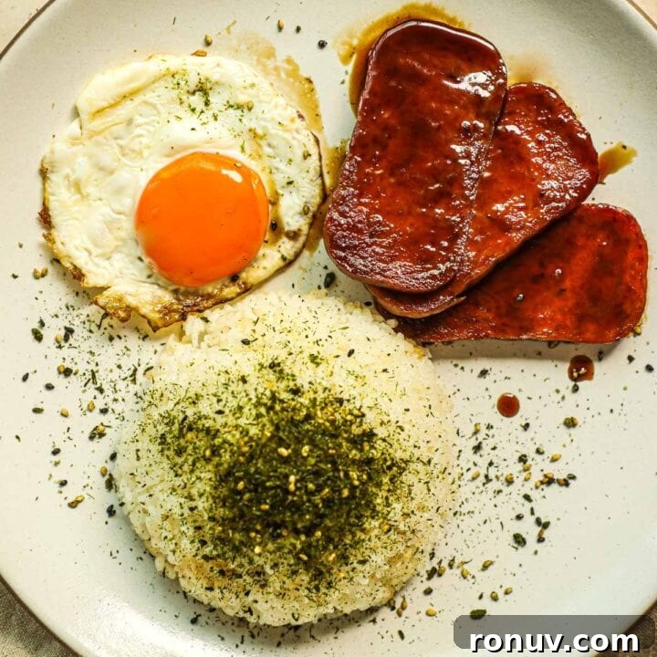 Flaky Bacon, Cheddar and Chive Breakfast Biscuits Recipe 10 Rice with furikake, sunny side up eggs, and fried teriyaki spam on a plate.