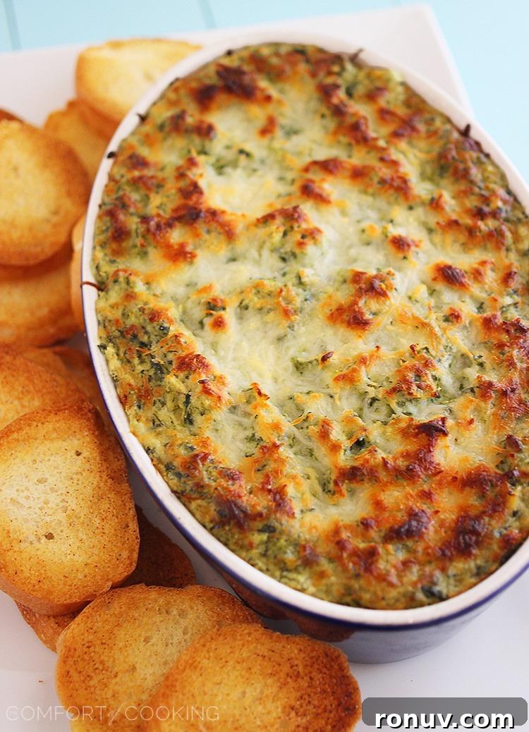 Hot Cheesy Spinach-Artichoke Dip – creamy, melty dip served with toasted baguette slices
