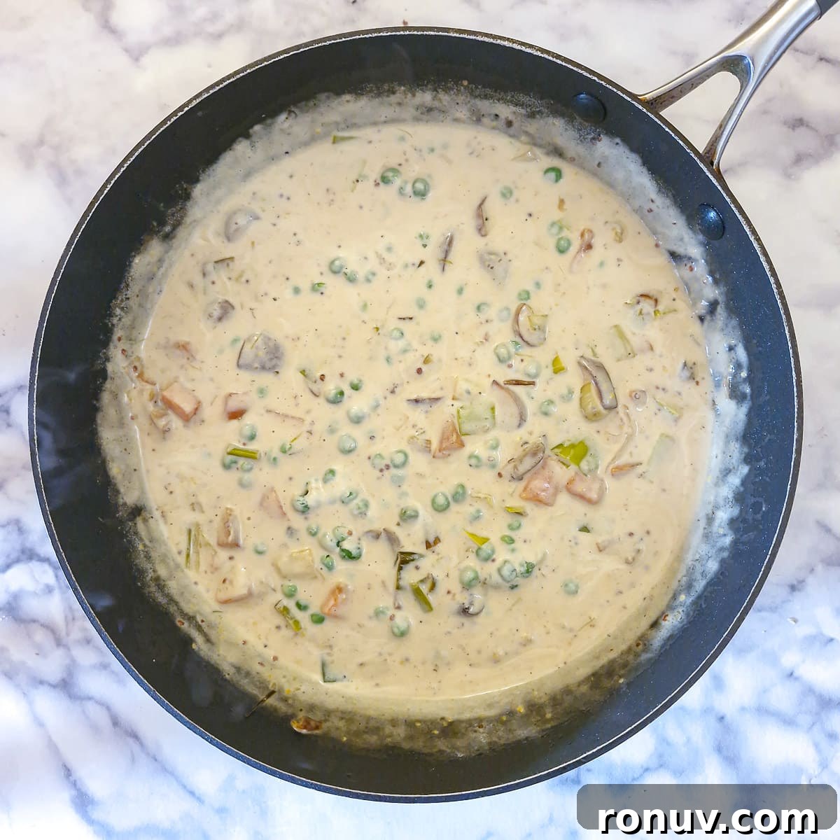 Turn Leftover Chicken Into Shepherd's Pie 9 Cream and peas added to the vegetables and stock.