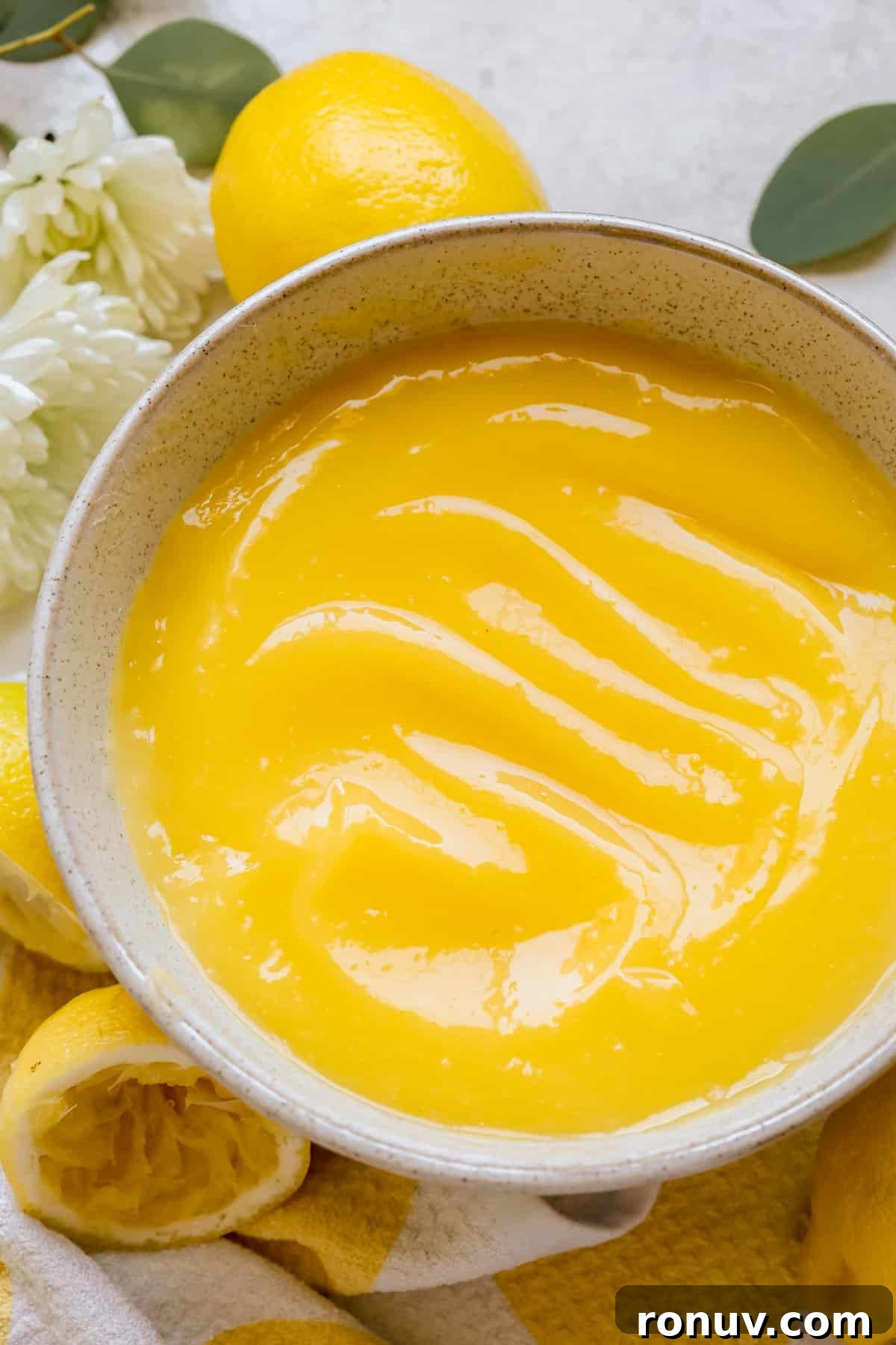 Silky Homemade Lemon Curd Recipe 2 a bowl filled with lemon curd.