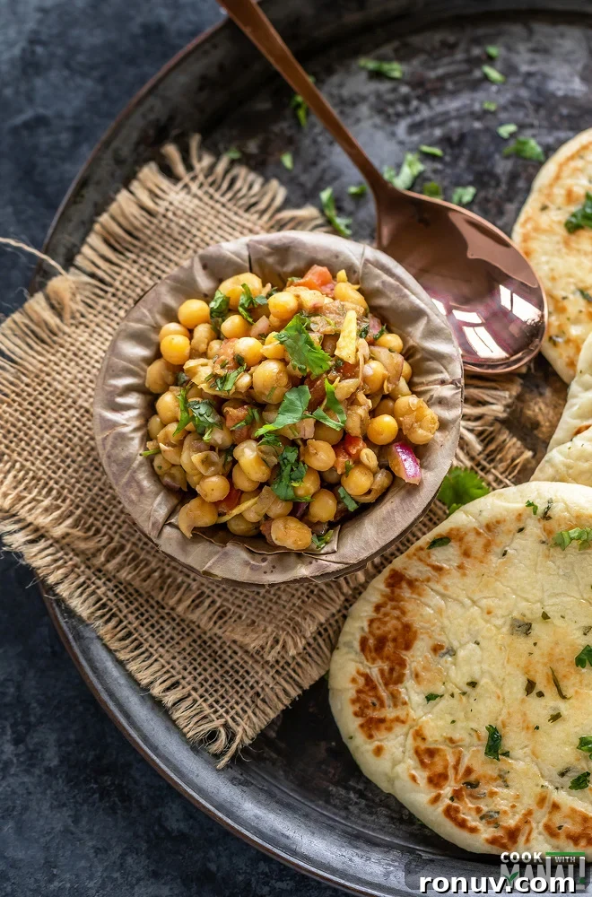 Matar Chaat Recipe: Tangy Indian Spiced Peas 2 matar chaat in a bowl made of leaves and kulcha placed on the side