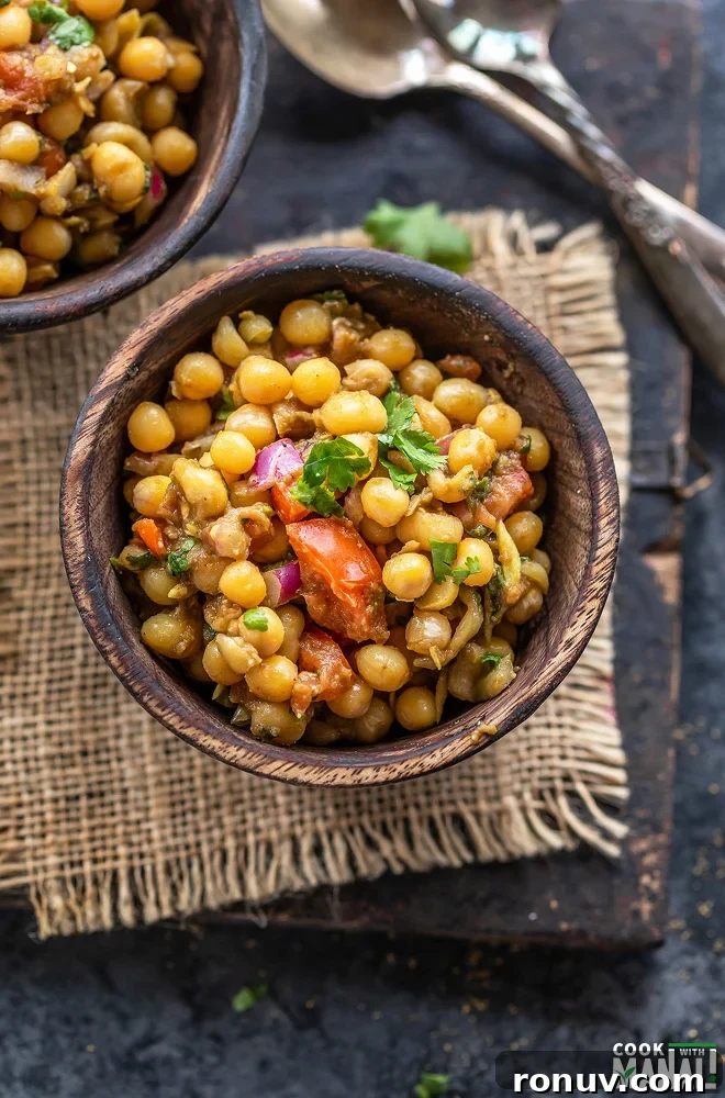 Matar Chaat Recipe: Tangy Indian Spiced Peas 4 bowl of matar chaat topped with cilantro and 2 spoons placed on the side