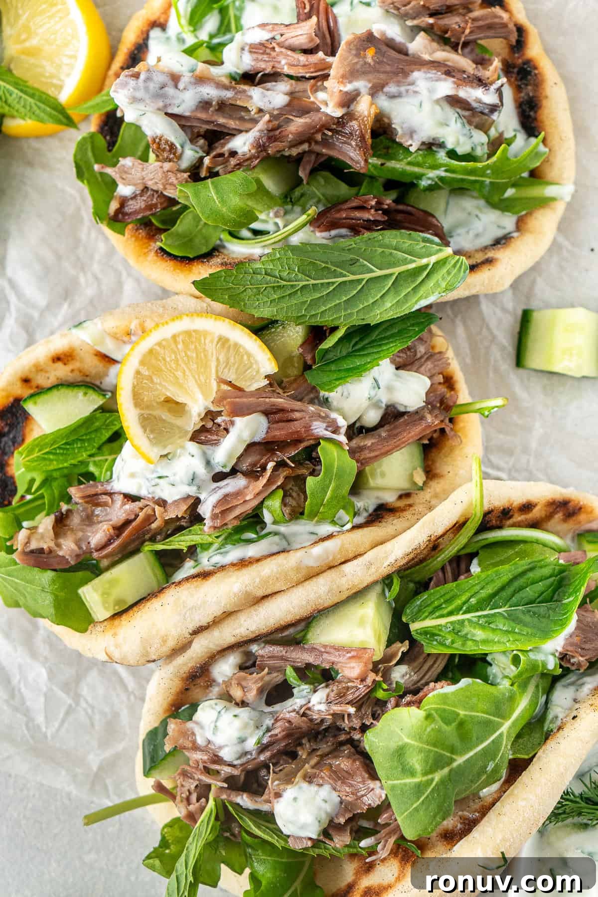Grilled Greek Lamb Pitas with Tzatziki and Feta 2 The Greek lamb pitas with fresh mint and lemon to serve.