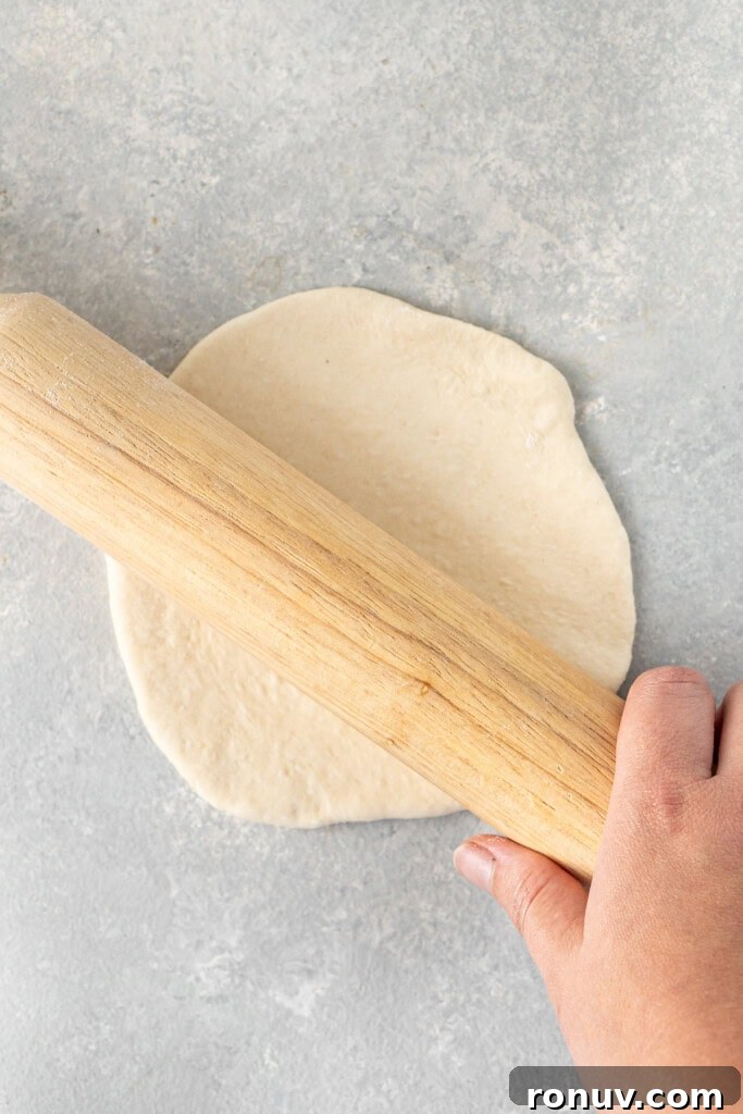 Grilled Greek Lamb Pitas with Tzatziki and Feta 8 Rolling out the pita dough.
