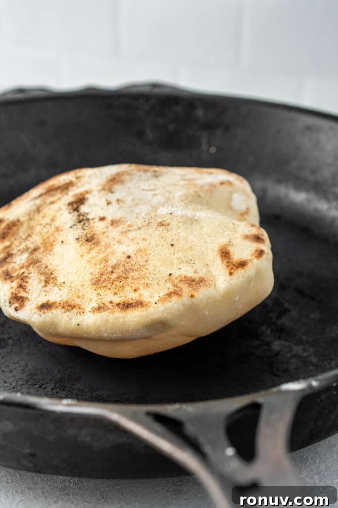 Grilled Greek Lamb Pitas with Tzatziki and Feta 10 The pita puffing up in the cast iron pan.