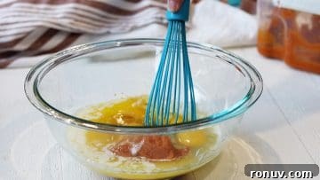 Gluten-Free Pumpkin Muffins That Taste Like Fall 8 Mixing wet ingredients in a clear glass bowl