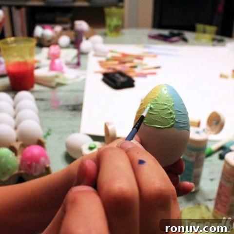 hand painting an egg