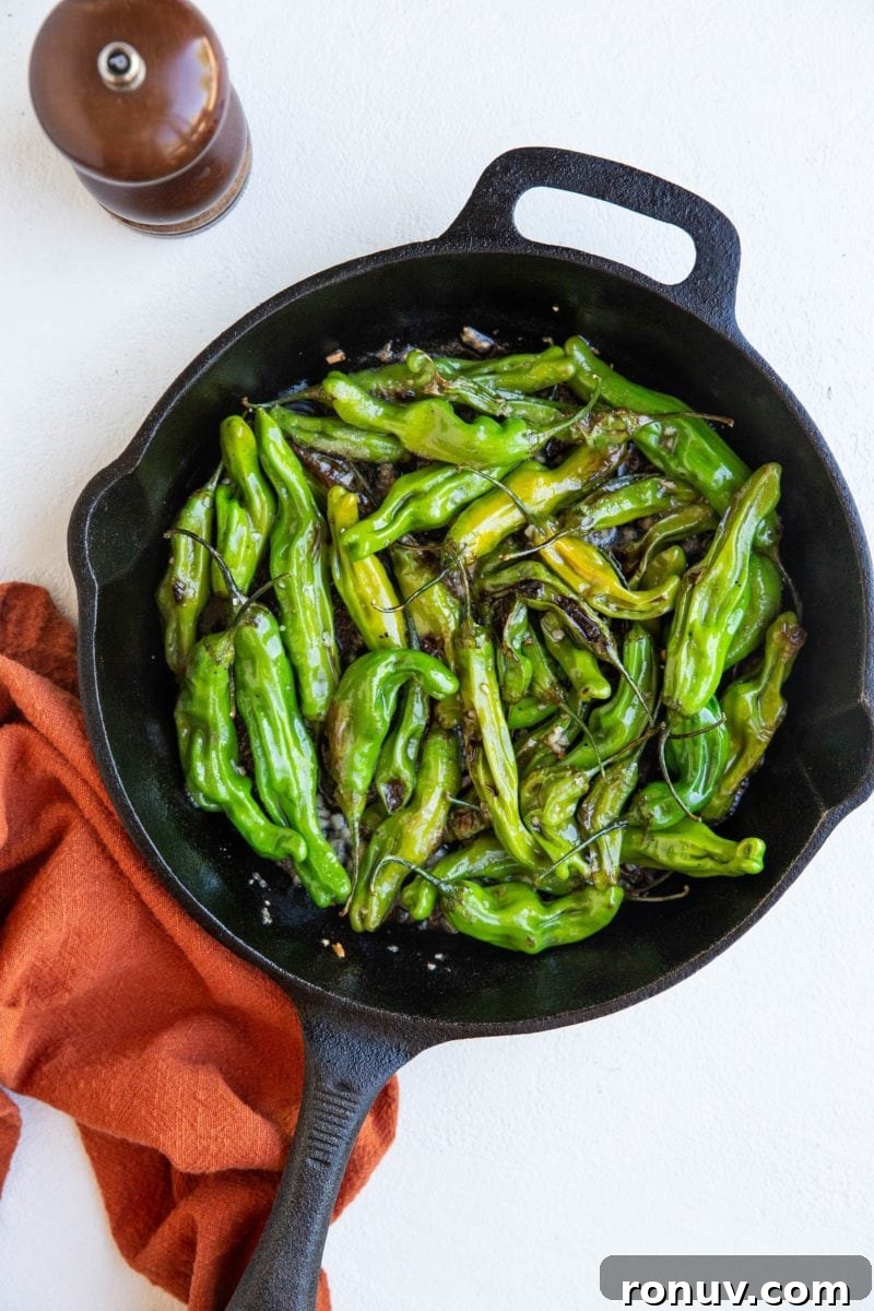 Blistered Shishito Peppers with Garlic Butter 3 cast iron skillet with blistered shishito peppers
