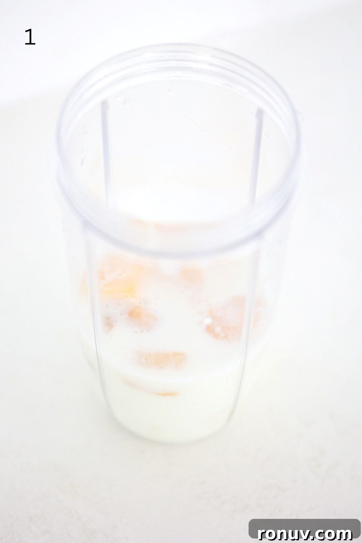 Tropical Mango Pineapple Smoothie Recipe 4 Mango Pineapple Fruit Smoothie ingredients in a NutriBullet Pro blender.