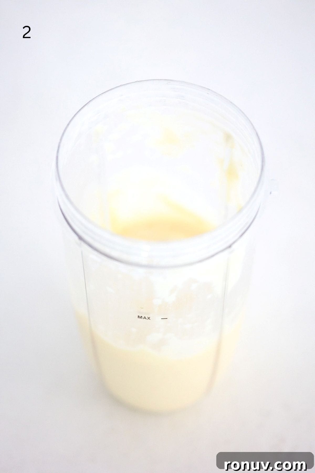 Tropical Mango Pineapple Smoothie Recipe 5 Mango Pineapple Fruit Smoothie in a NutriBullet Pro blender without the lid.