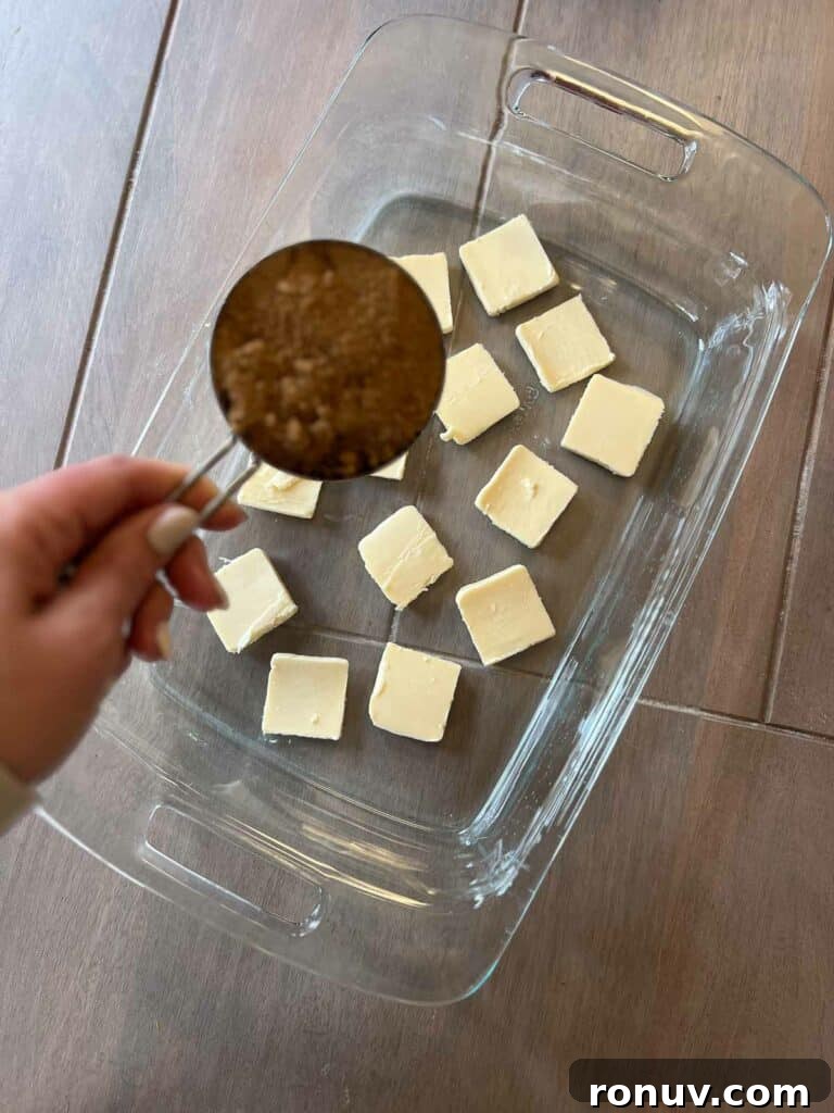 Gluten-Free Pineapple Upside-Down Cake Recipe 5 Gluten free pineapple upside down cake being made by butter and brown sugar going into pan