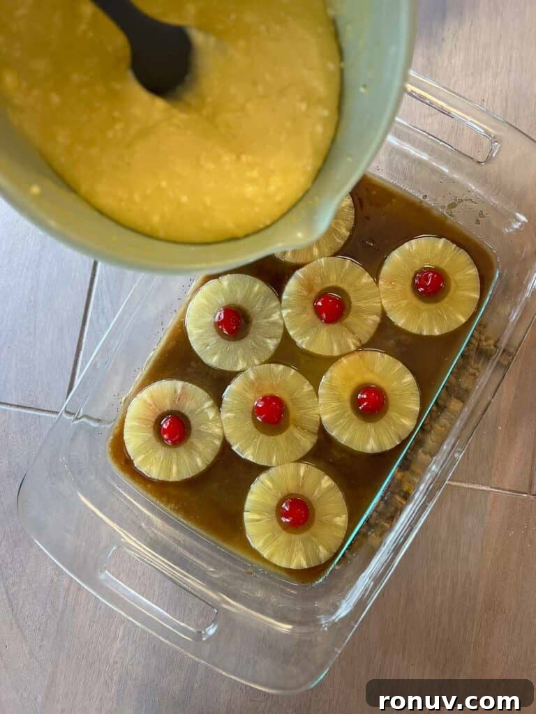 Gluten-Free Pineapple Upside-Down Cake Recipe 7 Gluten free pineapple upside down cake being made by cake batter being poured into pan