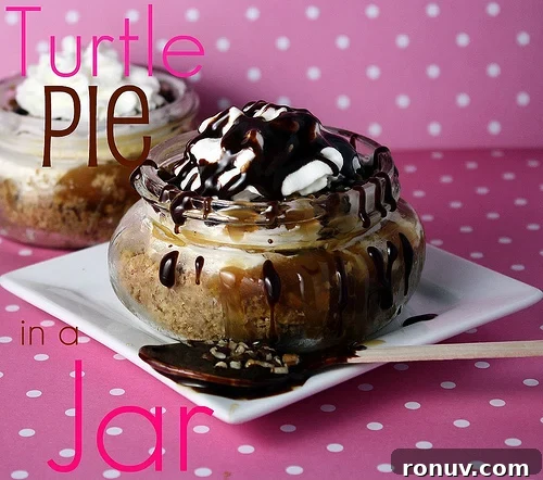Frozen Turtle Pie in a Jar Frozen Turtle pie in a small mason jar topped with drizzled chocolate topping on a white square plate