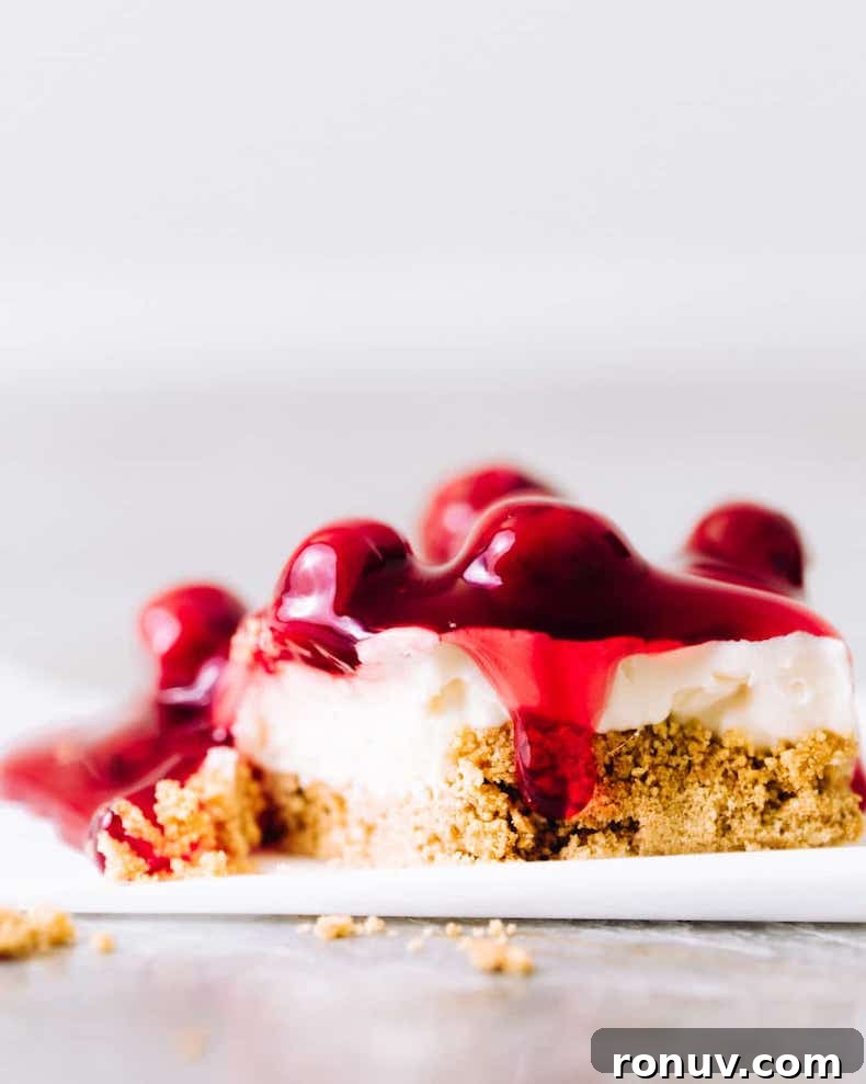 Valentine's Day Dessert Recipes for Date Night 11 No-bake cherry cheesecake bars with graham crust and cherry topping.