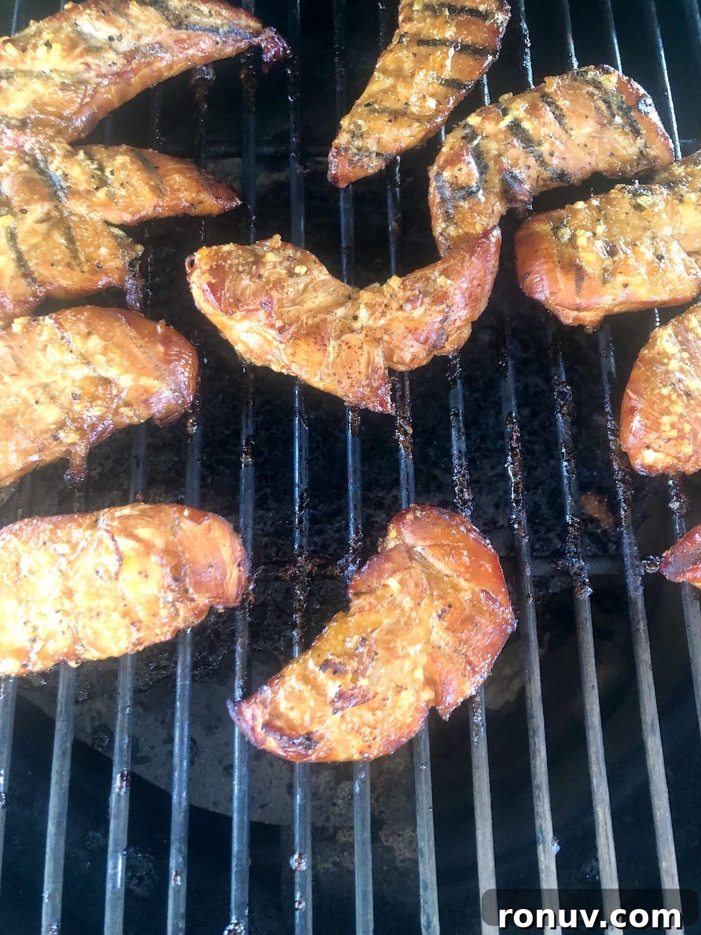 Sticky Apricot-Glazed BBQ Chicken Tenders 7 Apricot chicken tenders on a grill