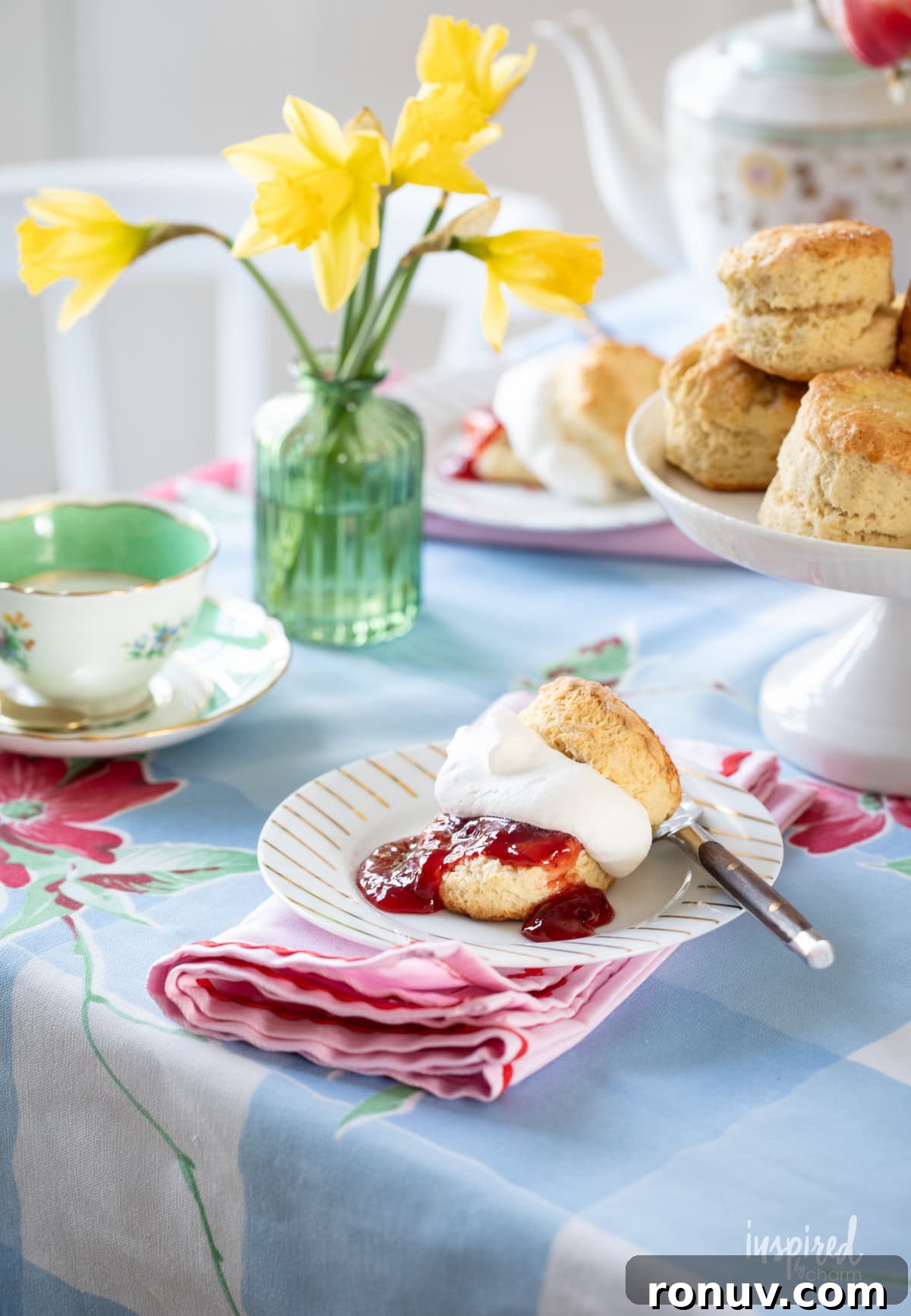 Classic Buttery Homemade Scones Recipe 4 afternoon tea setup with scones served on small plates.