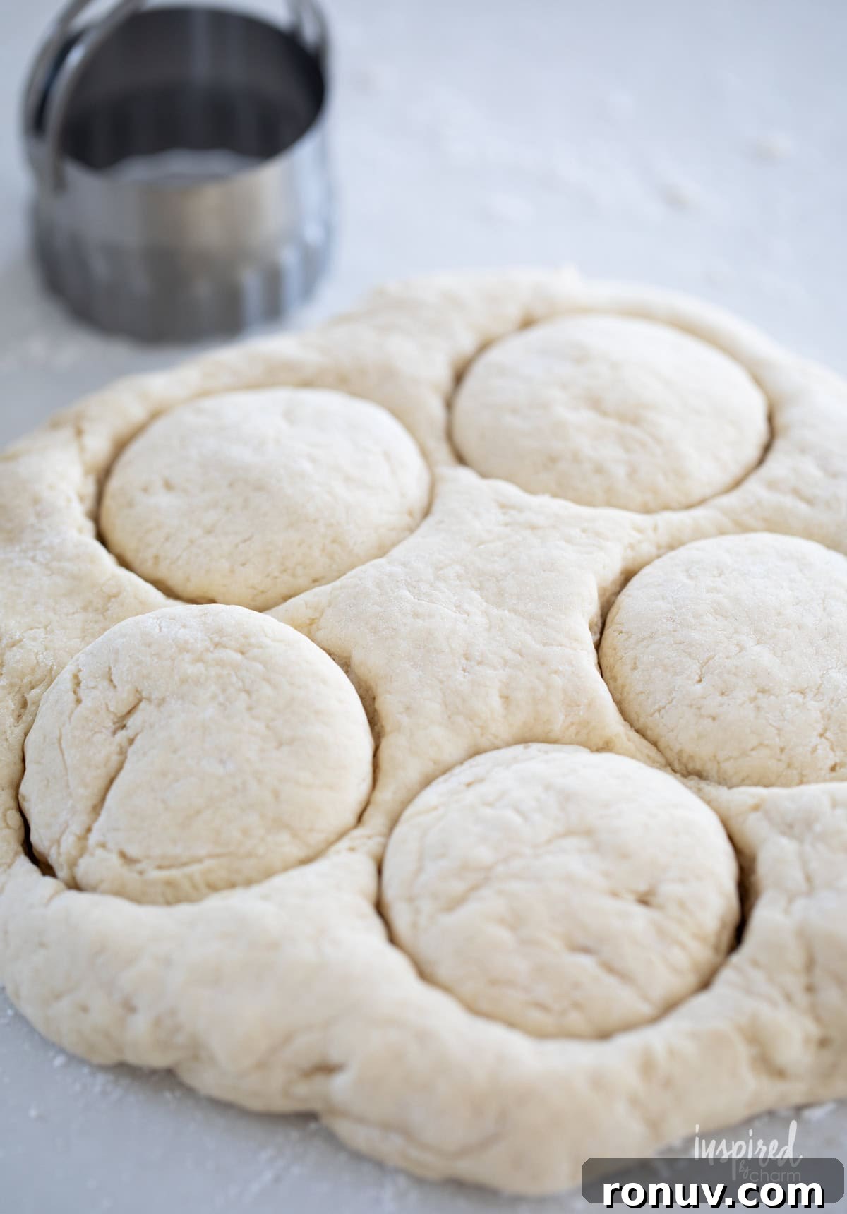 Classic Buttery Homemade Scones Recipe 10 homemade scones dough with scones cut out.
