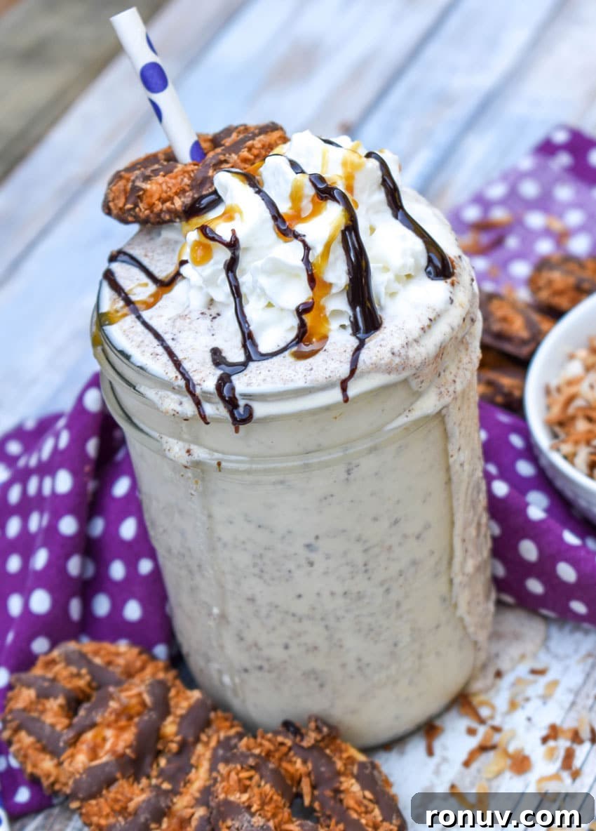 Samoa Cookie Milkshake Recipe with Caramel and Toasted Coconut 3 a samoa cookie milkshake on a wooden table