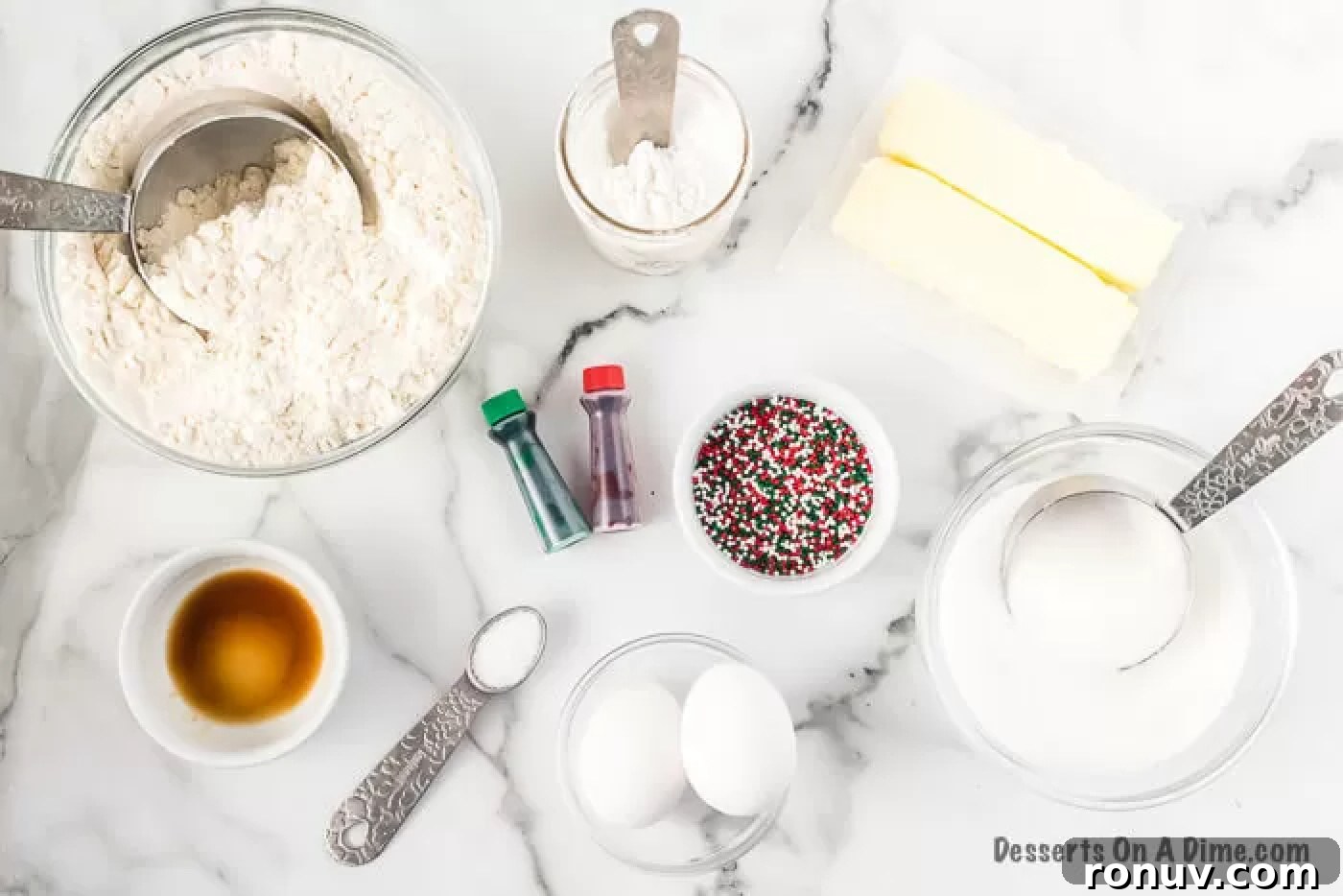 Ingredients for Christmas pinwheel cookies Ingredients needed - flour, salt, baking powder, butter, sugar, eggs, vanilla, red food coloring, green food coloring, christmas sprinkles