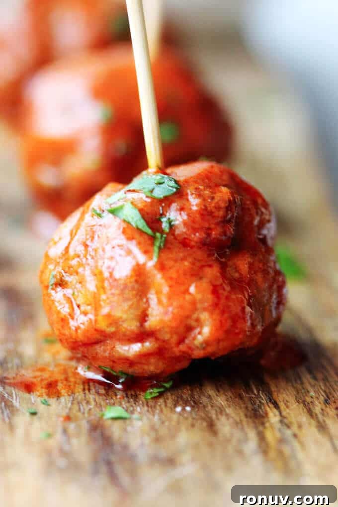 Buffalo Turkey Meatballs are a perfect appetizer for the Big Game. They're also a lighter alternative to a traditional chicken buffalo wings, not only because they have less fat, but also because they're baked, not fried. Not to mention they're also super easy to make. Buffalo Turkey Meatballs close up