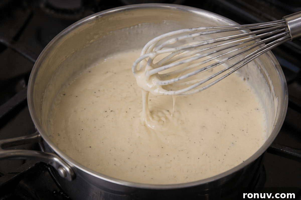 Kentucky Hot Brown Burger Recipe on the Big Green Egg 6 Mornay sauce in a saucepan