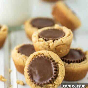 peanut butter cup cookies on white board with milk in background