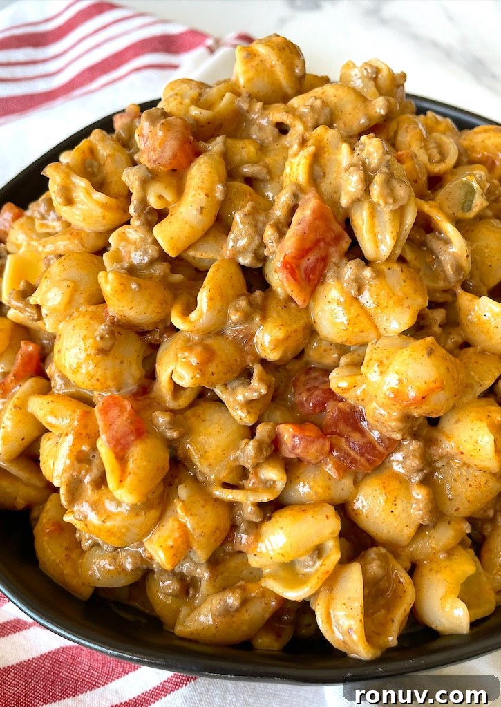 Quick Taco Macaroni and Cheese Dinner Recipe 9 The BEST ground beef dinner recipe! This taco macaroni and cheese dish is a family favorite meal for busy weeknights. It makes enough for a large family and is great leftover, plus it's budget friendly! These cheap ingredients are full of flavor. You don't need anything fancy to make a meal your family will ask you to make again and again.