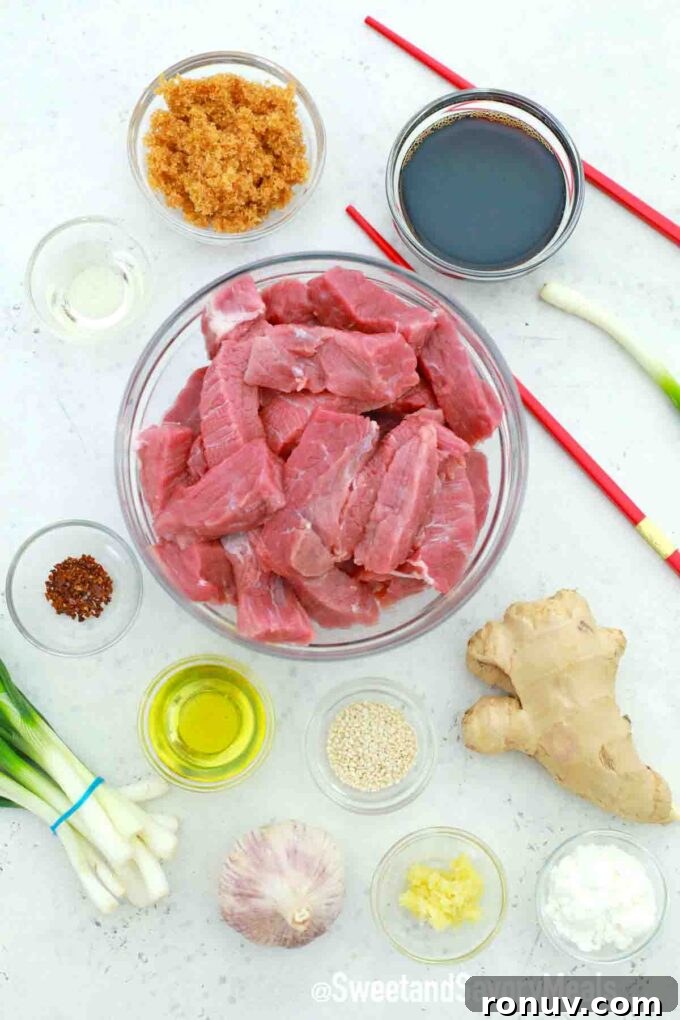 sliced beef in a bowl and other ingredients in bowls on a table