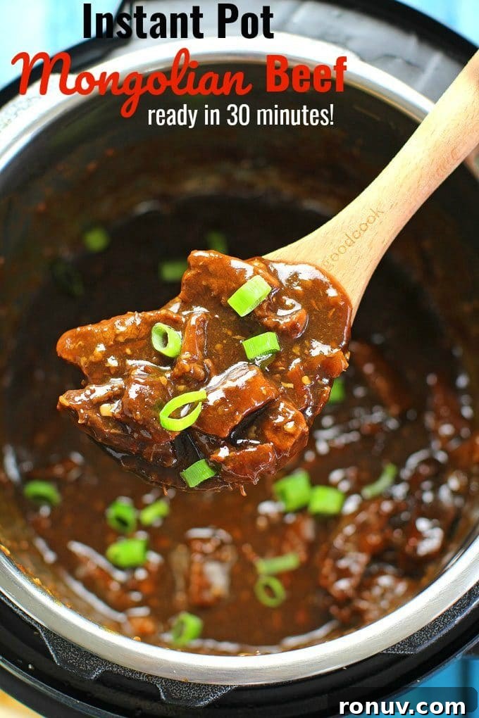 Instant pot mongolian beef garnished with chopped green onions on a wooden spoon