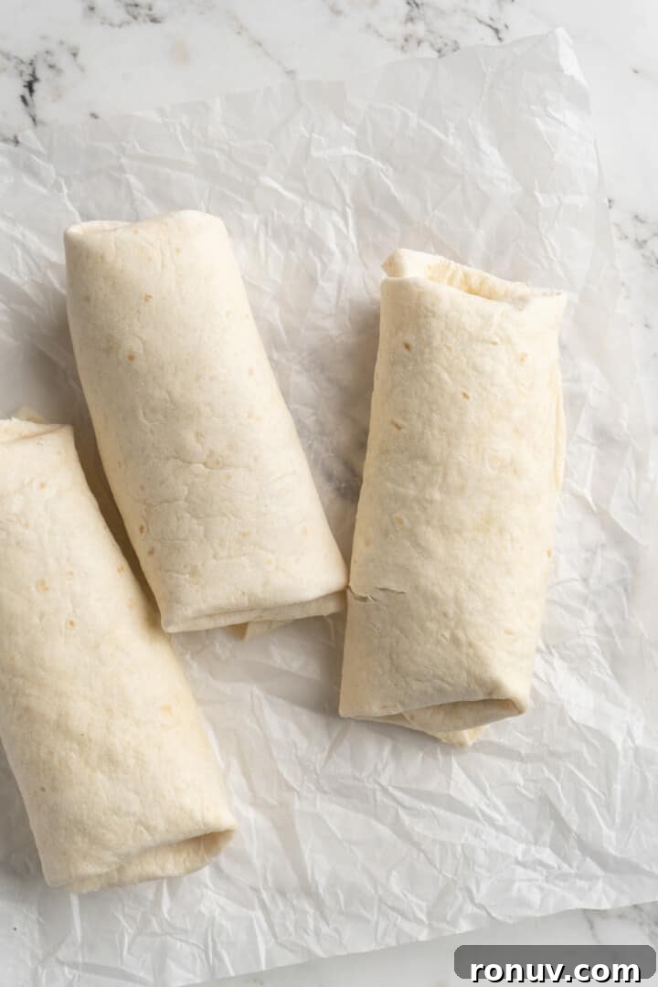 Wrapped vegan burritos Overhead view of wrapped vegan breakfast burritos
