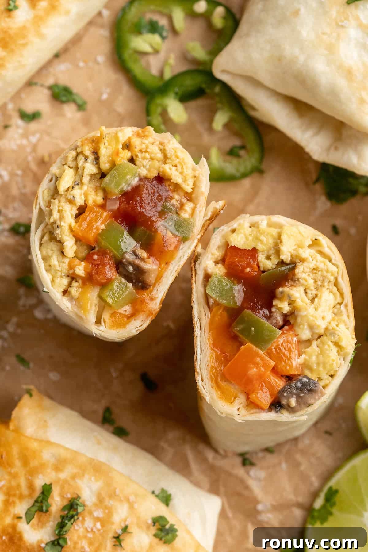 Vegan breakfast burrito cut in half Vegan breakfast burrito cut in half