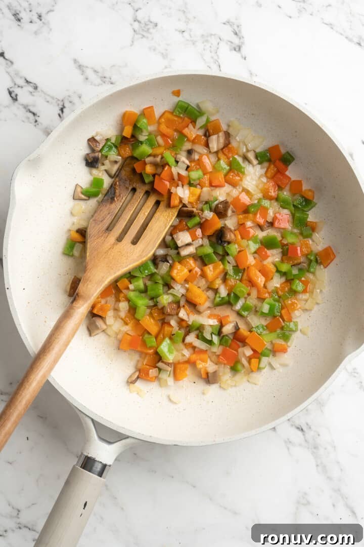 Sautéed vegetables for burritos Overhead view of sautéed vegetables in skillet