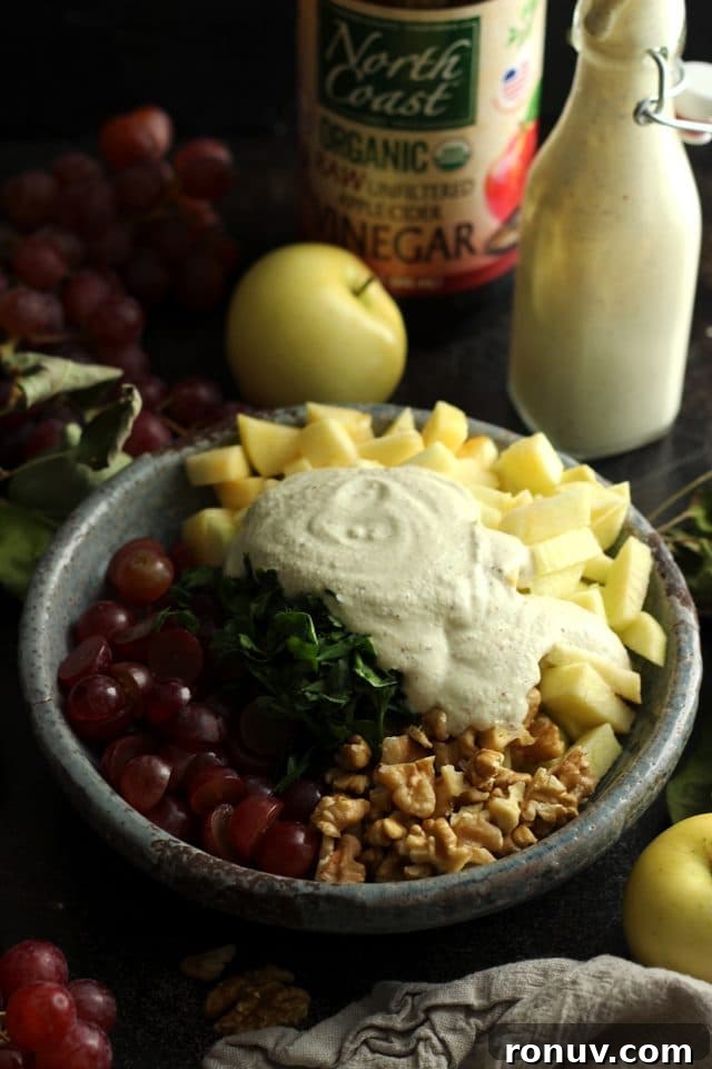 Vegan Waldorf Salad Recipe with Apples, Celery and Walnuts 5 Healthy Vegan Waldorf Salad Recipe - Cashew Dressing in a Bowl on Top of the Salad