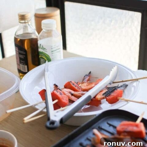 Papaya Lime shrimp skewers on the grill and in a white bowl