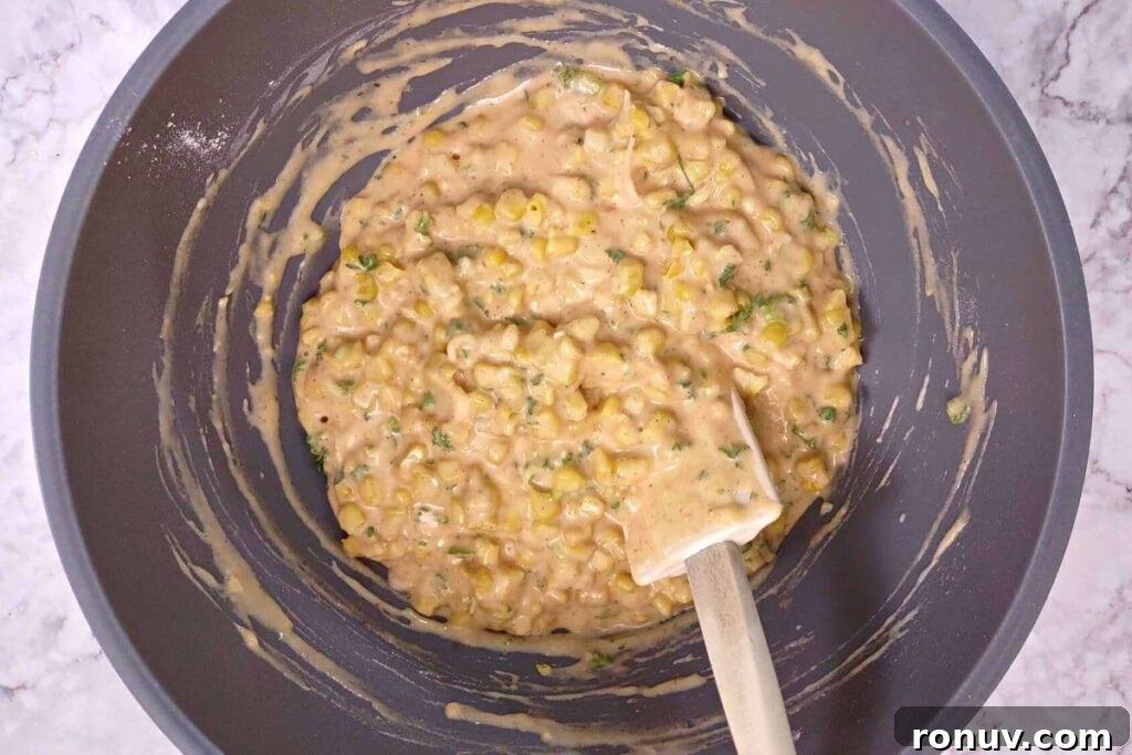 Air Fryer Corn Fritters: Crispy Summer Snack Recipe 9 fold corn and herbs into the batter
