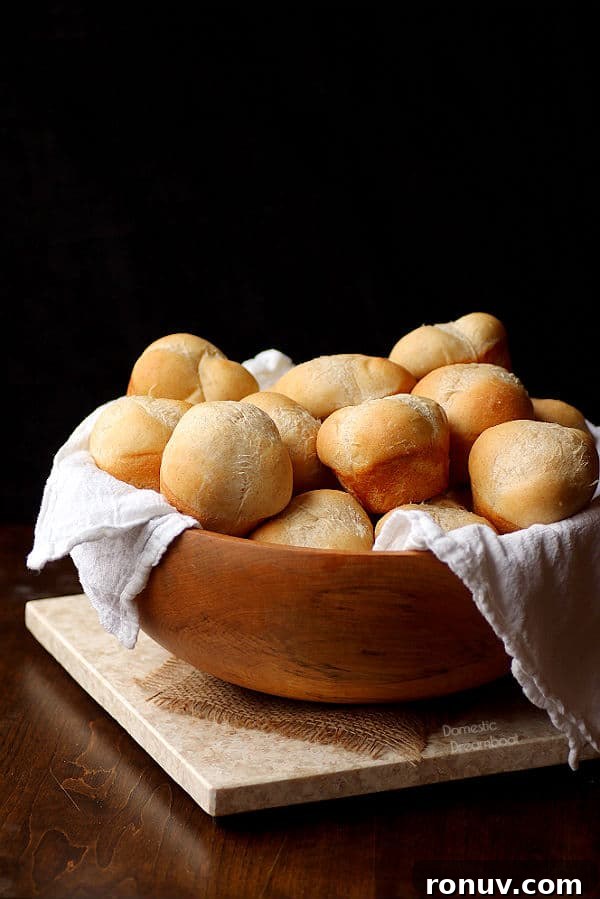 Garlic Bread Recipe: Crispy Herb and Parmesan Loaf 5 Dinner Rolls in a wooden bowl