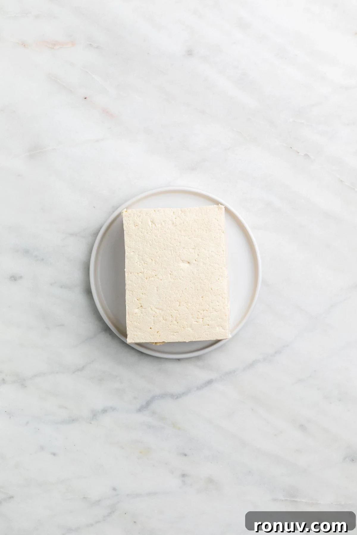 Freeze Tofu for Firmer Texture and Longer Storage 5 Firm tofu after freezing and thawing on a plate