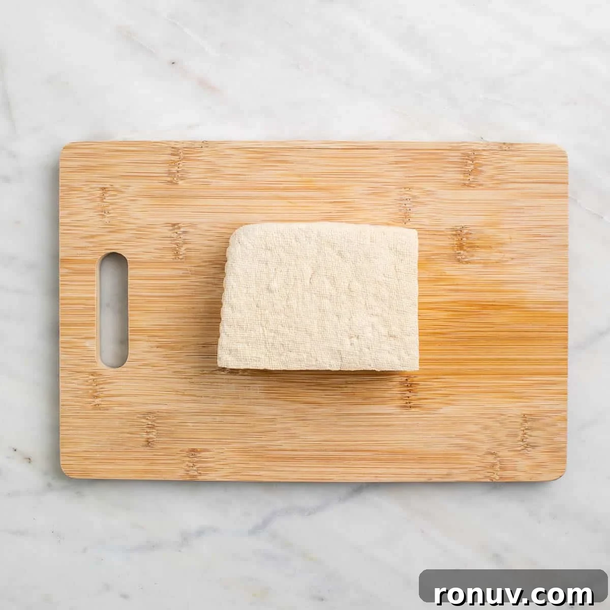 Freeze Tofu for Firmer Texture and Longer Storage 6 Block of tofu drained and patted dry