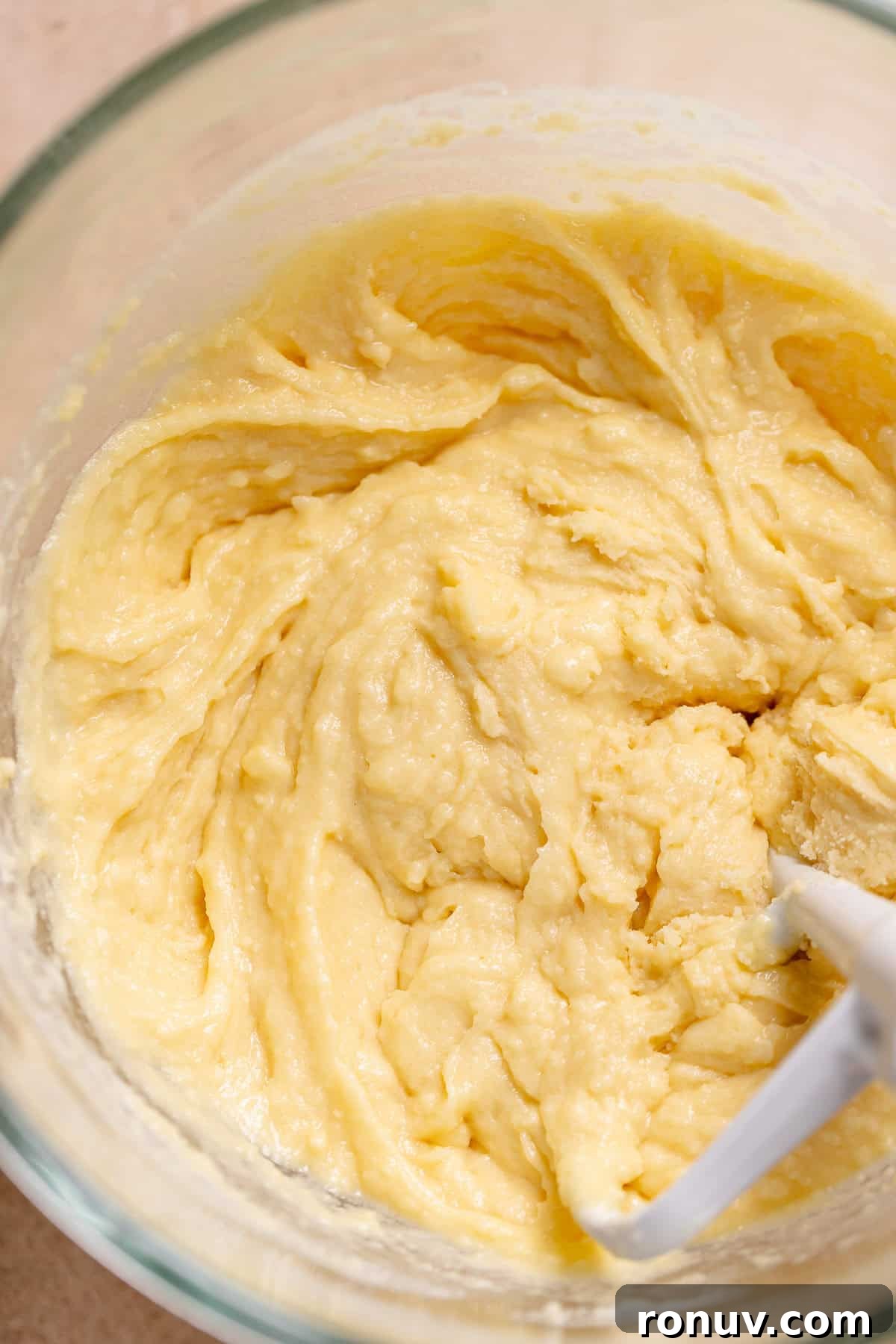 Homemade Funfetti Cake That Beats the Bakery 4 White cake batter in a stand mixer bowl mixed to a paste.