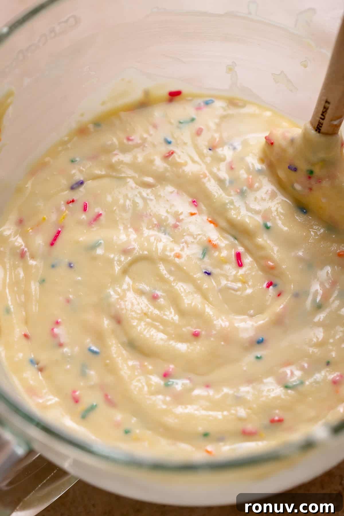Homemade Funfetti Cake That Beats the Bakery 5 Funfetti sprinkle cake batter in a glass stand mixer bowl.