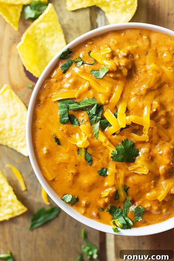 Creamy Homemade Chili Cheese Dip Recipe 4 This Homemade Chili Cheese Dip contains no processed cheese and no canned chili, just simple homemade goodness right in the slow cooker!! | www.countrysidecravings.com