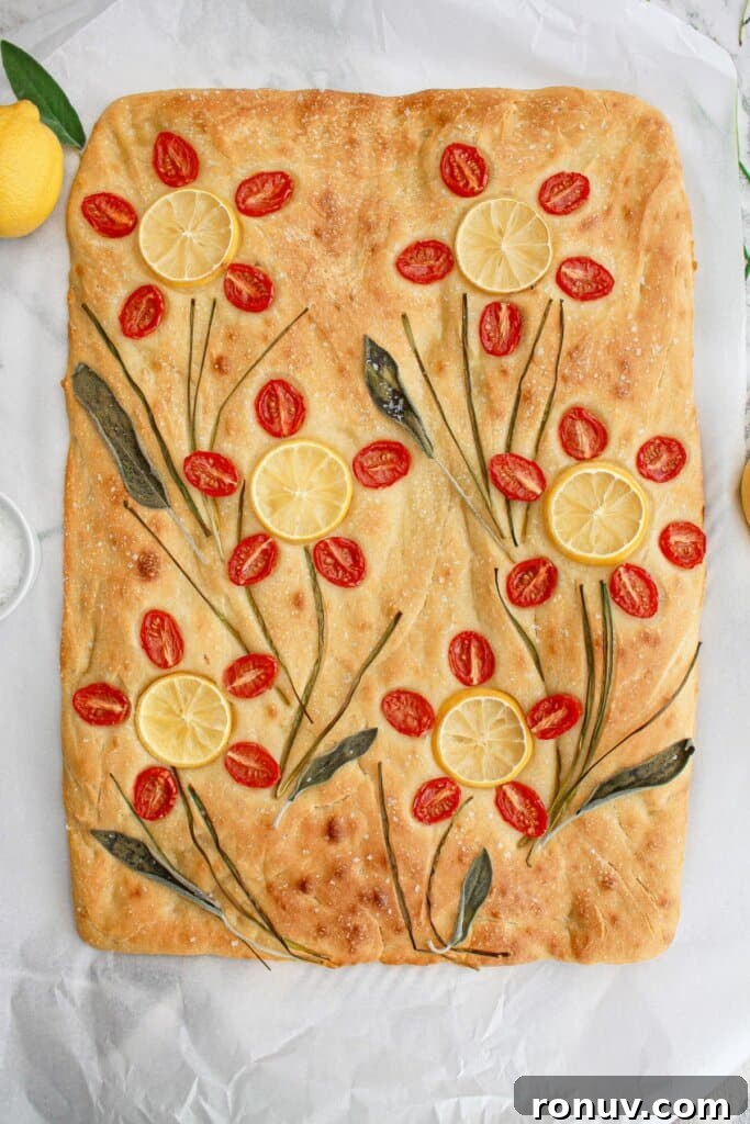 Tomato Focaccia: Classic Italian Bread 3 finished tomato focaccia bread on a parchment lined baking sheet,